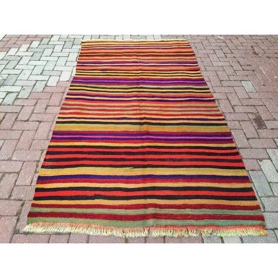 This beautiful, vintage, handwoven kilim is approximately 60 years old. It is handmade, of very fine quality in all...