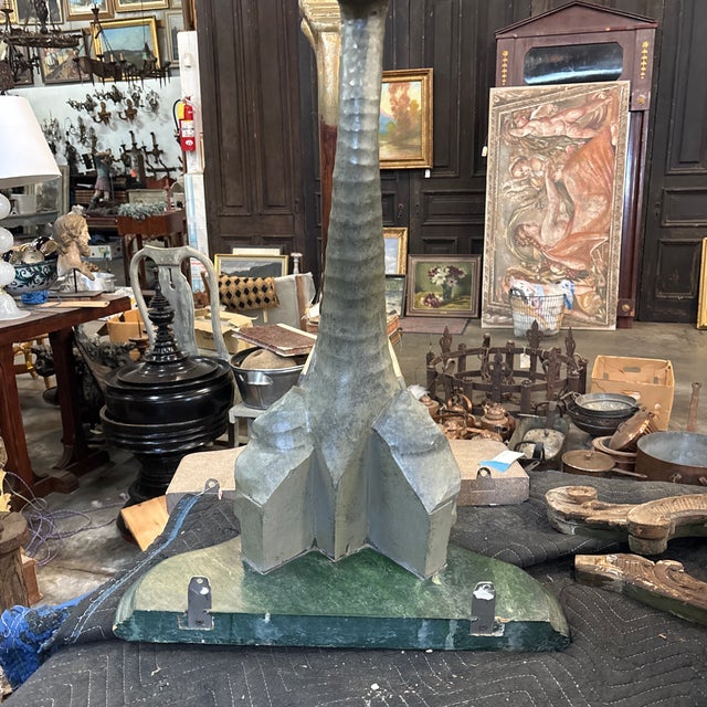 A delightful wall bracket with an elephant head portrait and trunk as single "leg". This late 20th century figurative and...