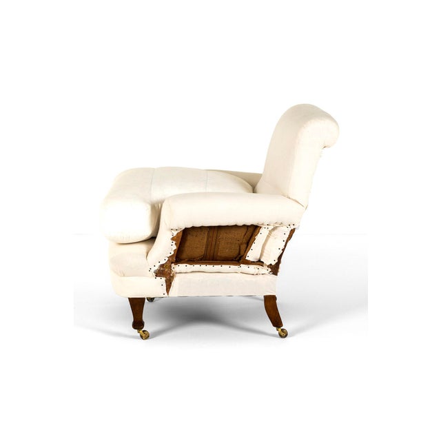 A grand belle epoque period deconstructed armchair with an oak frame and mahogany turned front legs, raised on original...