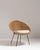 This 1960s mid- century Modern rattan woven chair with upholstered seat from France is woven in honey-toned rattan as a...