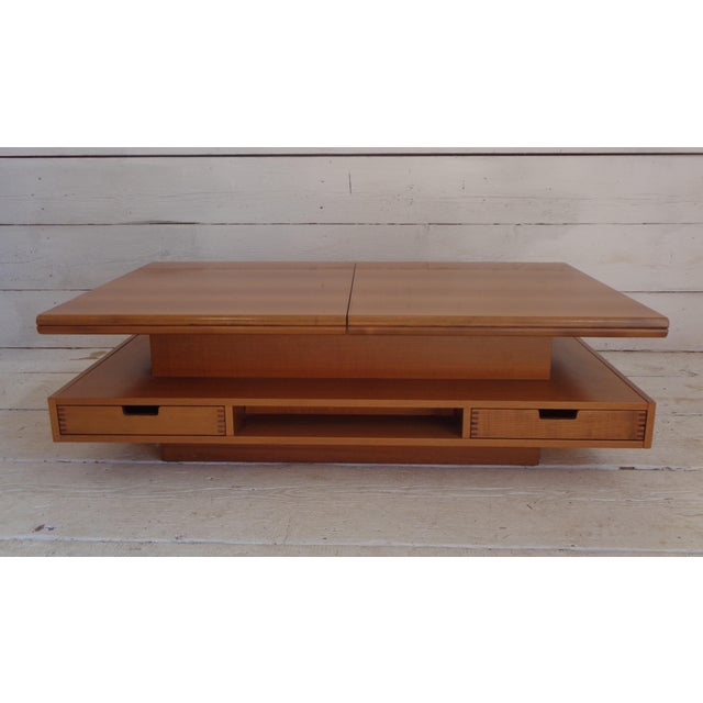 This elegant blond walnut coffee table is part of a series designed by Claudio Salocchi for the productions of Luigi...