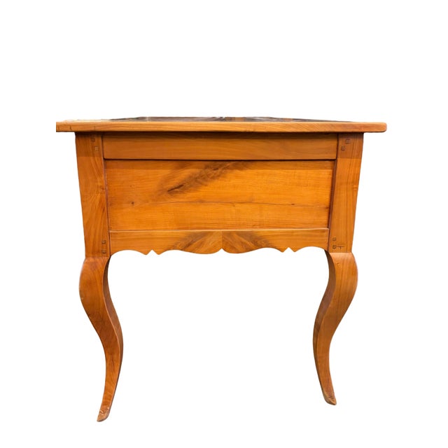 Antique French Provincial writing desk featuring elegant cabriole legs, a scalloped apron, and two side drawers fitted...