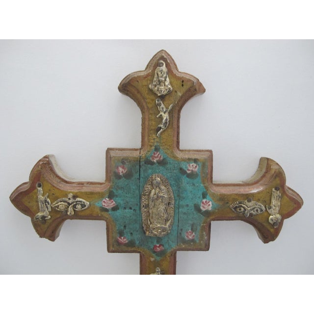 SStunning hand crafted Mexican folk art Milagros cross. Light tone wood adorned with a painted, distressed turquoise, red,...