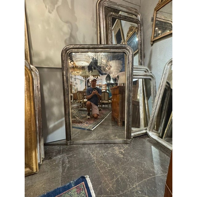 The 19th c. French Transitional Silver Leaf Mirror is a luxurious addition to any room. This mirror features intricate...