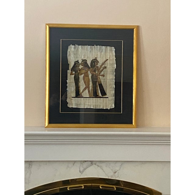 Gorgeous hand-painted Egyptian women painting done on papyrus. Professionally matted and framed. Matte looks to be fabric...