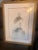 This framed fine art print features a detailed pencil sketch of two bald eagles, characterized by their expressive,...