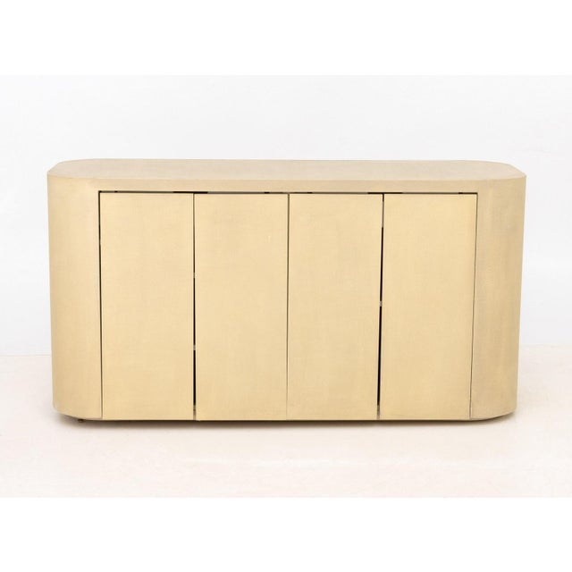 Karl Springer Style Beige Grasscloth Sideboard, four doors opening to two compartments, each with top slide drawer above...