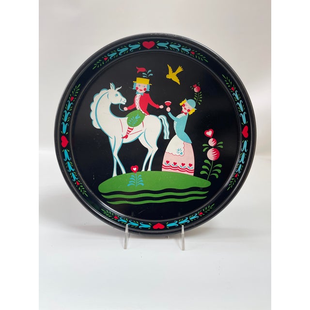 Whimsical vintage Dutch or Swedish metal tray showcasing folk art design with hearts, tulips, and bird featuring a...