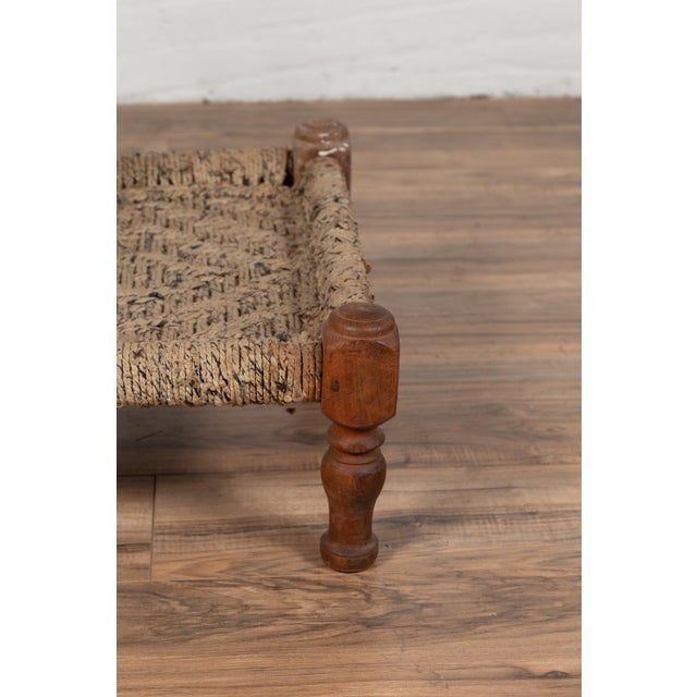 Rustic Indian Low Wooden Chair With Rope Seat and Weathered Appearance For Sale - Image 13 of 16