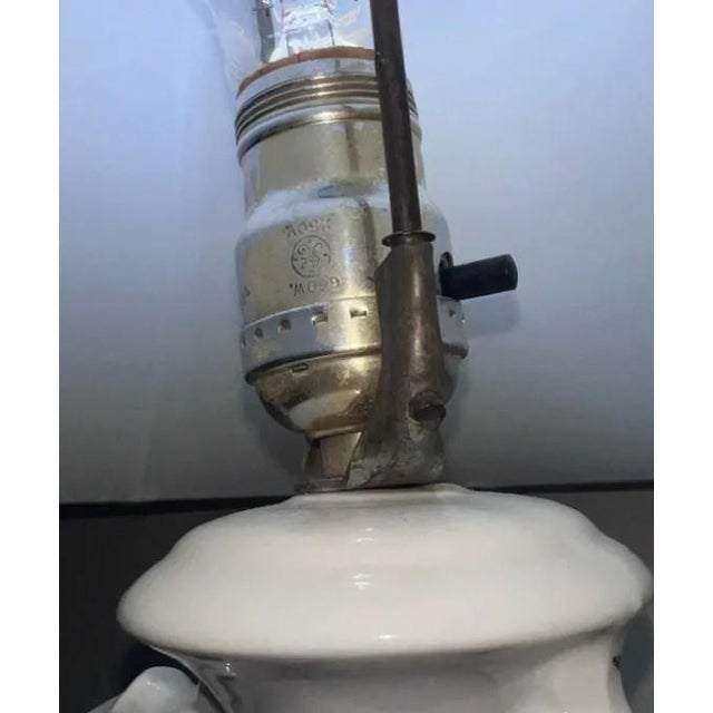 This elegant vintage table lamp brings together Old World artistry and timeless decorative appeal. The sculptural...