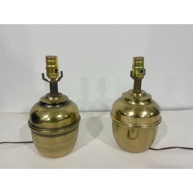 Add a touch of sophisticated glamour to your space with this striking pair of vintage solid brass table lamps. Featuring a...