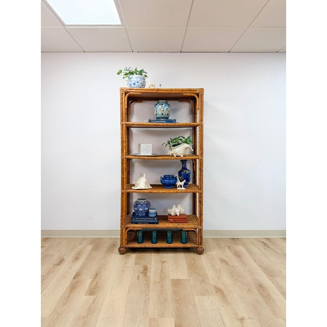 This vintage étagère combines the glamour of Hollywood Regency design with the natural warmth of coastal materials,...