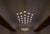 Monumental Mid Century Chandelier in Glass, Metal and Patinated Brass, The Netherlands, 1960. A highly unique and...