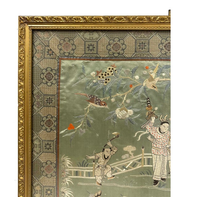 This object is a 19th-century framed Chinese silk embroidered panel titled "Dancing in the Landscape". Crafted during the...