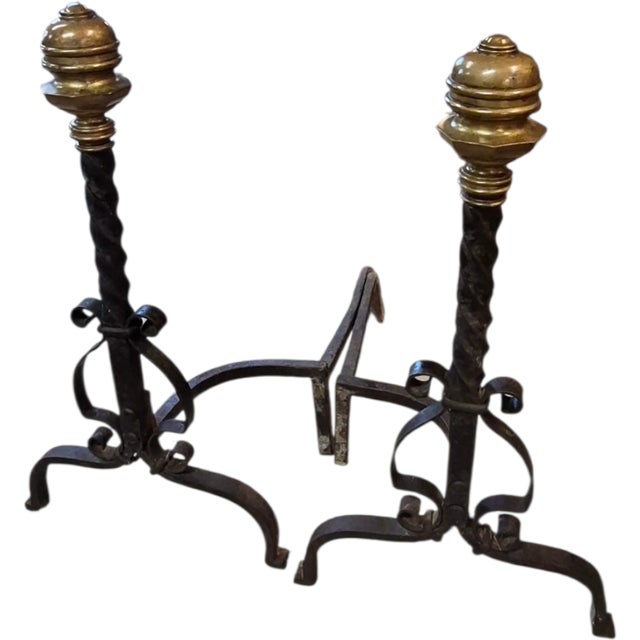 fine pair of heavy forged wrought iron fireplace andirons with stout urn-form brass finials, spiral twisted iron shafts,...