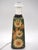 A lovely vintage forest green table lamp with yellow sunflowers surrounded by a beautiful glaze that resembles blades of...