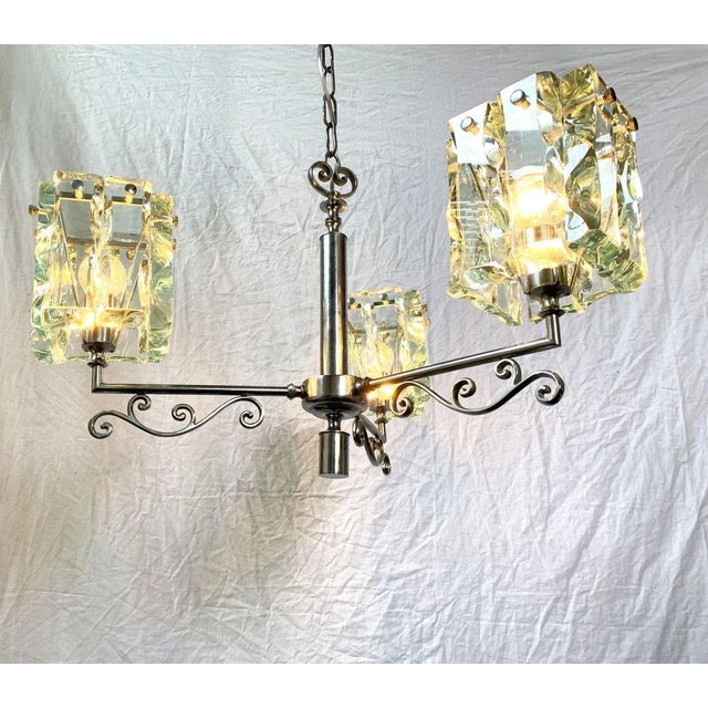 Beautiful chandelier company Cristal art about 1970. Chandelier with transparent white glass, handmade. These glasses are...