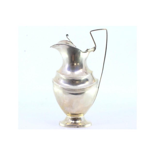 Silver Milk Jug with Hinged Lid Knob and Strips, in Very Good conditions. Designed before 1890 This piece has an...