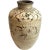 DETAILS A large antique, pottery wine jar with a short neck and rolled rim on an ovoid body with a creamy white slip-...
