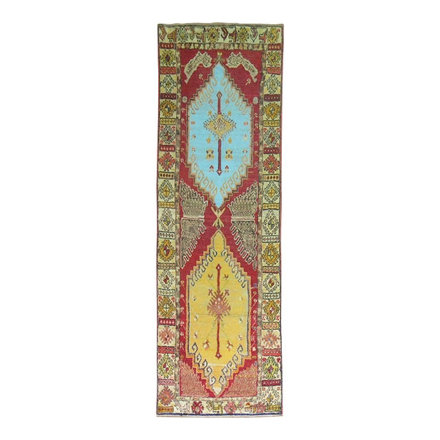 Mid 20th Century Red Field Anatolian Oushak Runner with Electric Blue and Gold Medallions For Sale