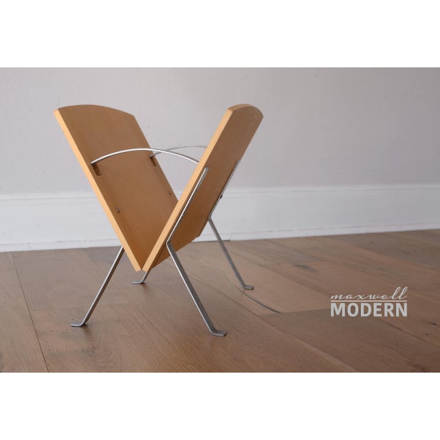 What a cool magazine rack! This piece is perfect to add a little postmodern Memphis flair to any decor! Made of metal with...