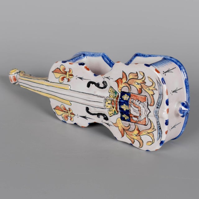 A late 19th century French faience decorative miniature vessel commonly known as a bouquetière or bud vase, in the shape...