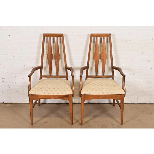 A gorgeous pair of Mid-Century Modern high back armchairs or dining captain chairs In the manner of Broyhill Brasilia USA,...