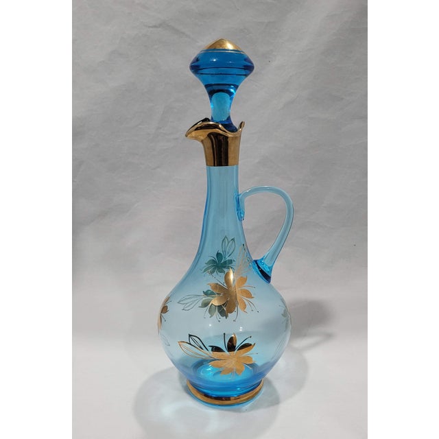 As pretty as a summer's day. This is a gorgeous set of glasses and decanter with a the most amazing bottle stopper! This...