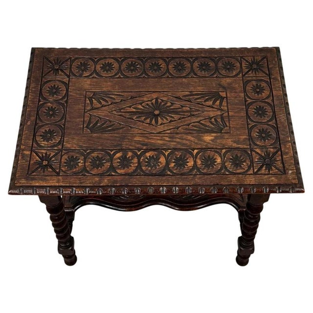 A handsome 19th-century English side table, finely crafted from solid oak and distinguished by its elegant barley-twist...
