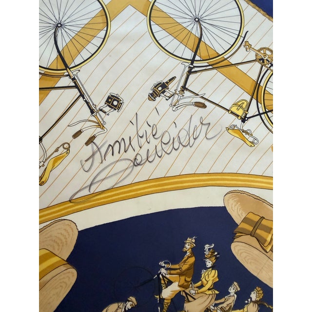 Hermès 'Les Bécanes'—originally created in 1974 and reissued in 1990—is a silk scarf featuring a design by Raymond...
