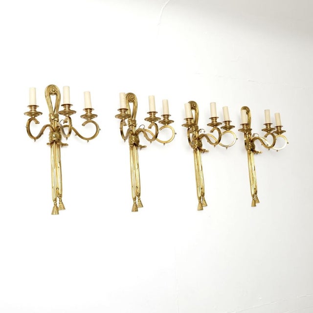 A stunning set of four antique brass wall sconce lamps. They were made in Belgium, they date from around the 1950’s. The...