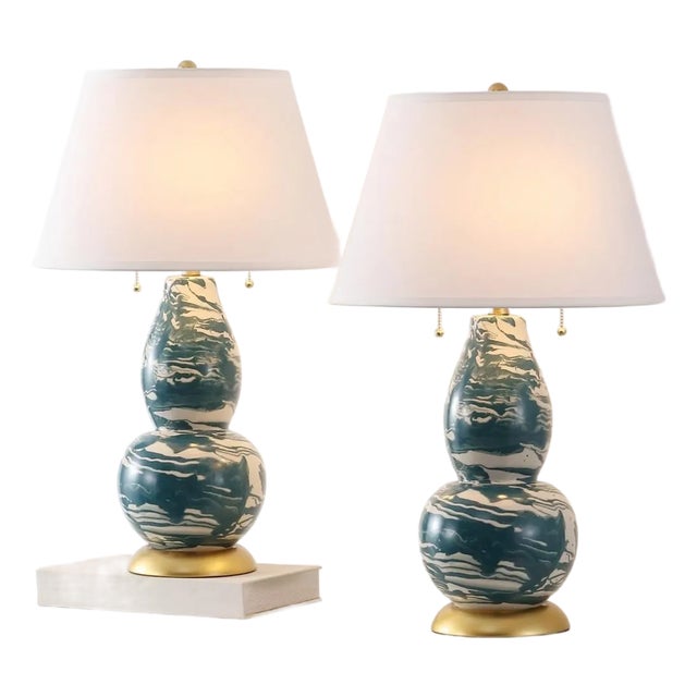 Illuminate your space with elegance and artistry with the Color Swirls Glass Table Lamps in Blue and White. Crafted with...