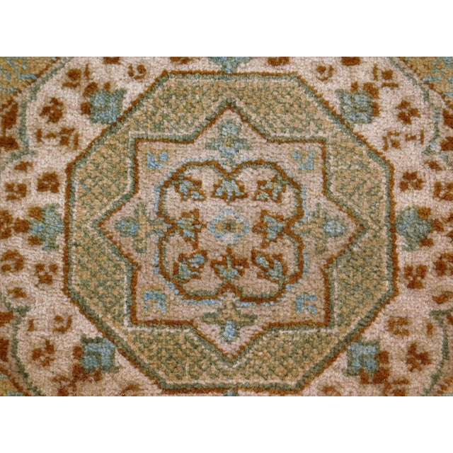 Geometric medallions in neutral tone colors. Inspired by Mamlook style. 100% pure wool pile on cotton foundation. 3'x 12'