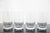 Tiffany & Co. set of 4 thin-walled crystal glasses with a mid-century modern style acid-etched criss-cross or diamond...