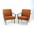 Elegant pair of Czechoslovak armchairs produced by Tatra in the 1960s. Featuring sculptural oak frames with dark stained...