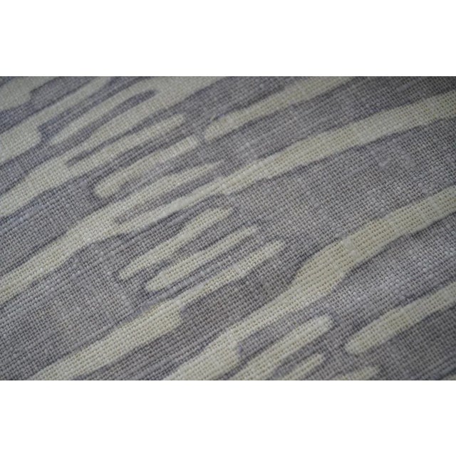 This set of two contemporary custom decorative pillows brings texture and tonal elegance to any space. One features a...