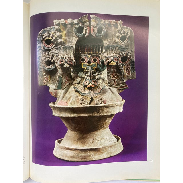 An 11.5 x 9.5 Hardbound Coffee Table Book with Leather-Bound Cover and Original Jacket, and which presents the ancient...