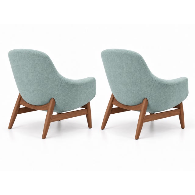A sculptural pair of “Torso” lounge chairs attributed to Danish designer Hans Olsen. Each chair features a gently rounded...