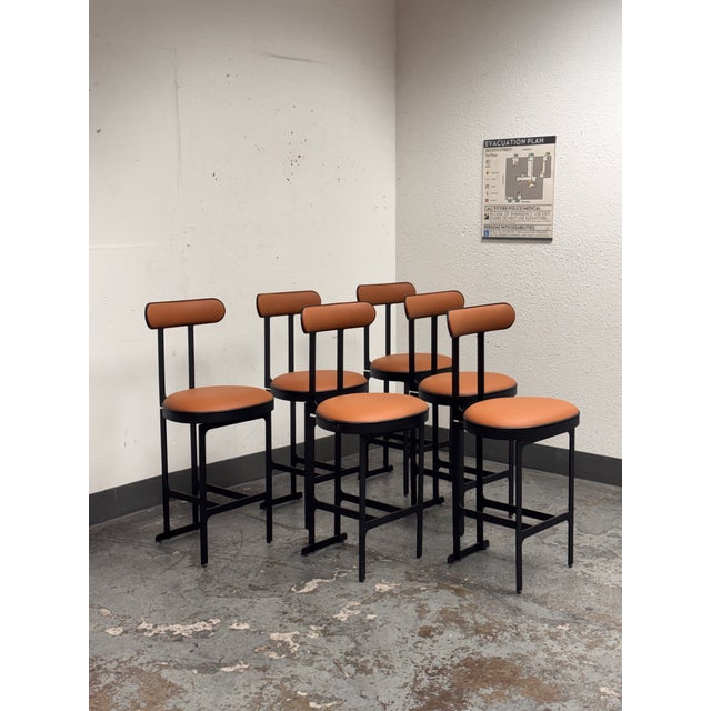 Design Plus Gallery presents a Pair of Custom Design Swivel Faux Leather Counter Stools from Michael Oren Design. In the...
