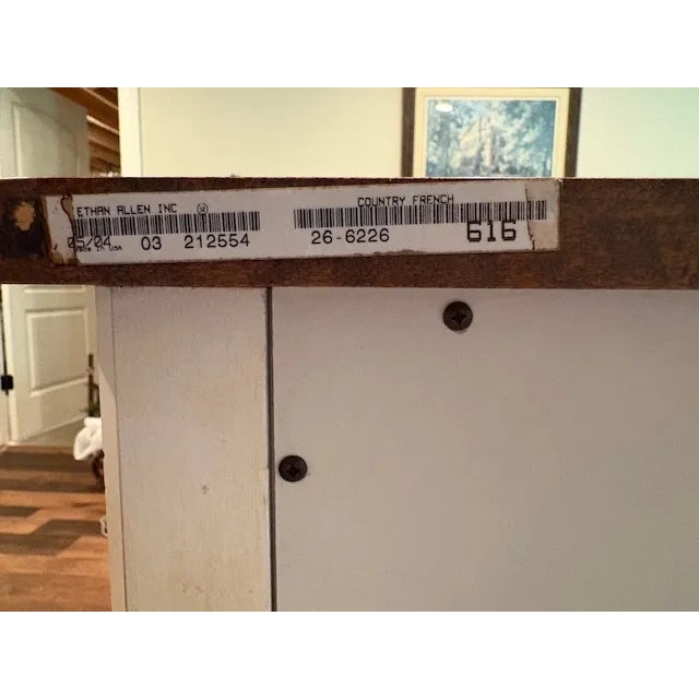 Ethan Allen Country French Buffet. Purchased around 2004. Solid wood dual finish. 3 drawer in middle which includes a...