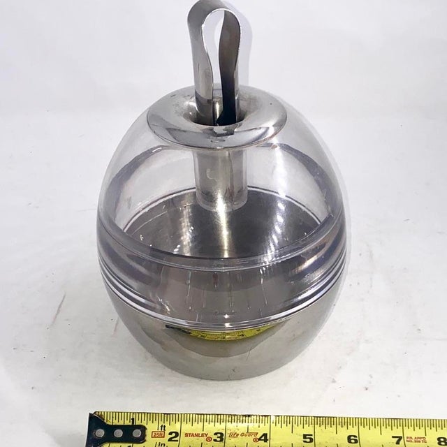 A definitive icon of 1970s Space Age minimalism, this is the sought-after "Metro" ice bucket originally retailed by Crate...