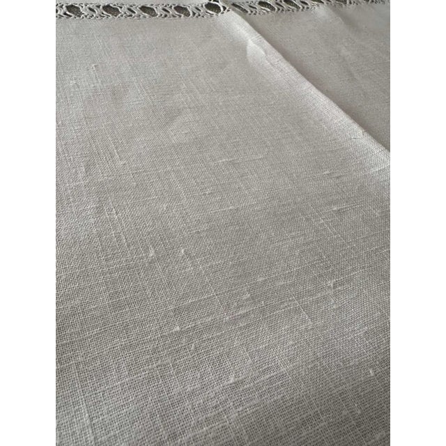 "A beautiful antique French linen towel, handwoven in luminous flax and finished with refined drawn thread work â an...