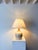 A large ceramic table lamp with a rustic and earthy two tone glaze, dating from the late 20th century. The speckled...
