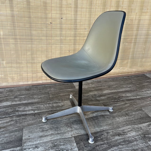 Mid Century Modern Swiveling Molded Side Chair by Eames for Herman Miller. Circa 1960s Features an iconic design, a...