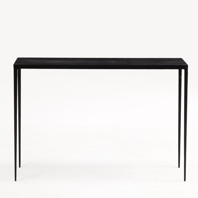 A refined pair of contemporary console tables inspired by the understated luxury of Jean-Michel Frank. Each features a...