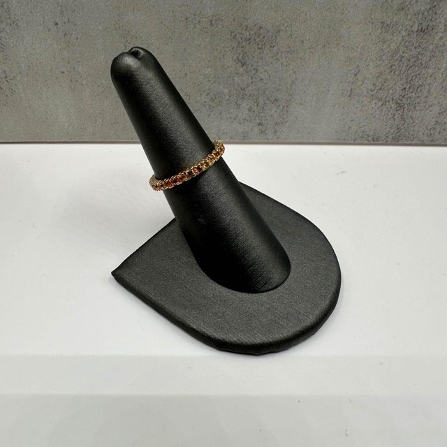 This stunning Yellow Sapphire Full Eternity Ring in 14kt yellow gold features 1.4ctw of round yellow sapphires, offering...