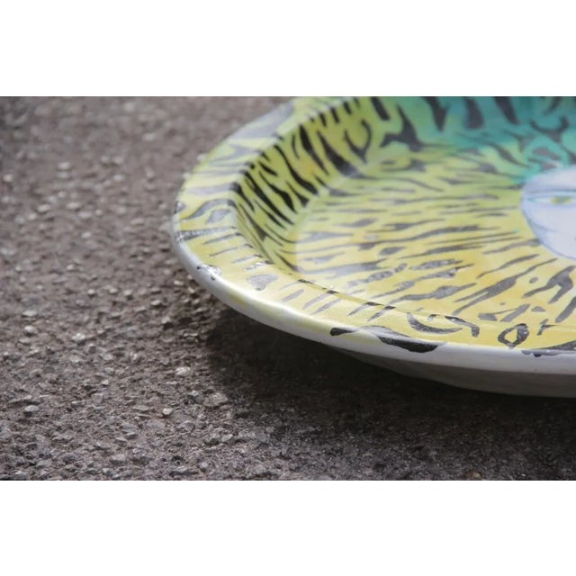 Italian large round ceramic dish plate from the 1980s. Multicolored face yellow green. Seller Location: Palermo, IT