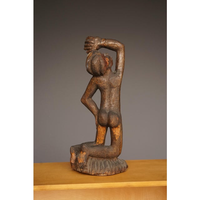 An early c20th kneeling figure of a woman in pain. Very much in the style of the early twentieth century German...