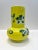 A beautiful hand painted porcelain vase. Rocking a vibrant yellow and decorated with flowers. A perfect piece for the Spring.
