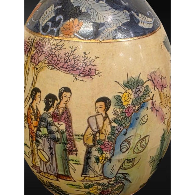 Chinese export, second half 20th century A charming ornamental egg of generous proportion, decorated in the Satsuma taste...
